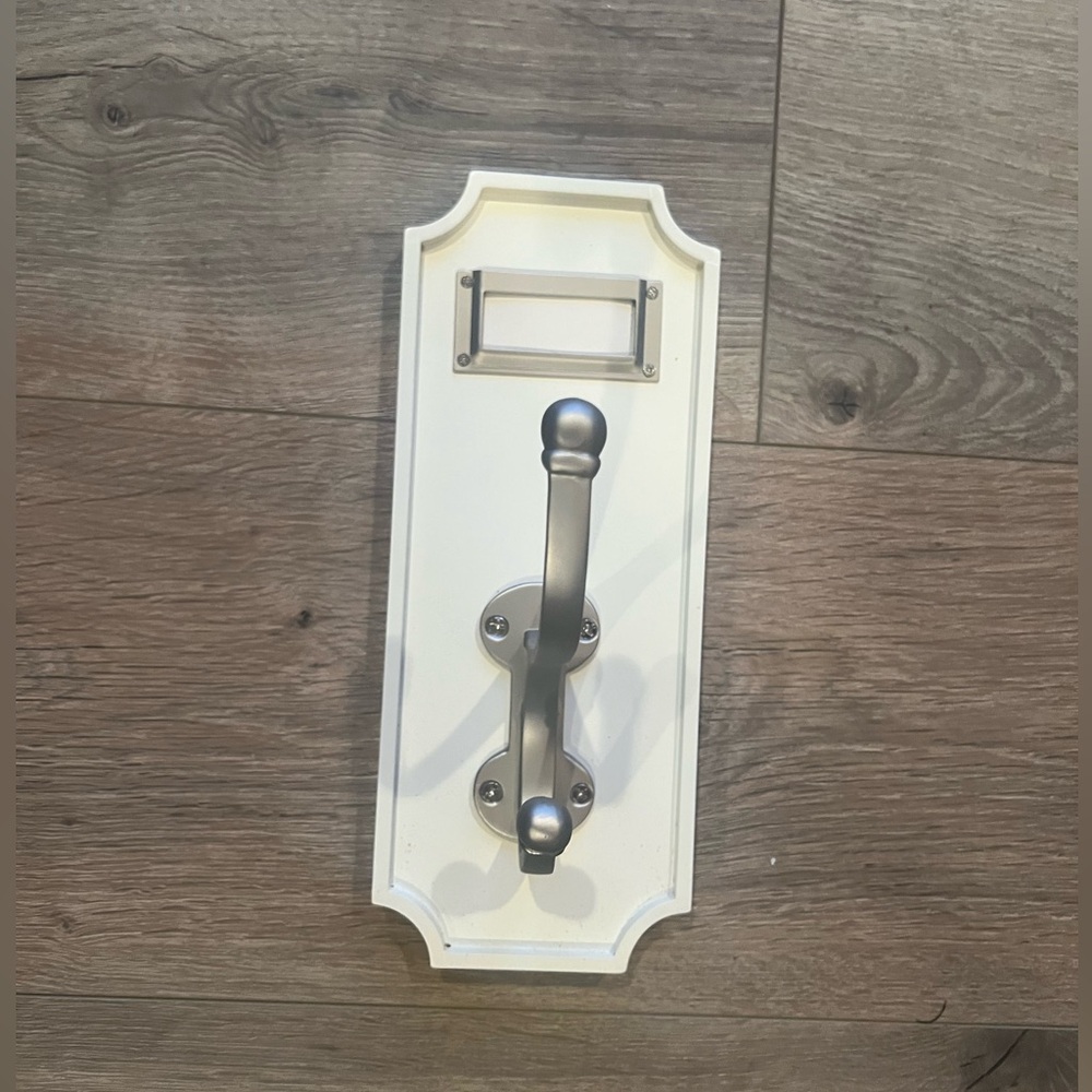 Two Pottery Barn schoolhouse hooks.